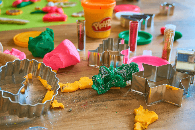 Cookie cutters and paydoh on a table